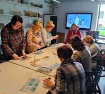 A group of teachers in a workshop room