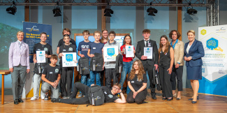 group photo with 17 people: students of the three winning teams of the AI Challenge