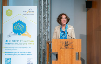 A woman is giving a speech