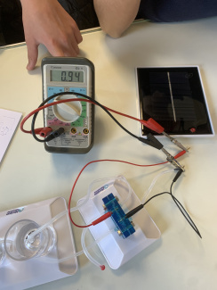 A hydrogen fuel cell electrolyser with a solar cell being built by students in class