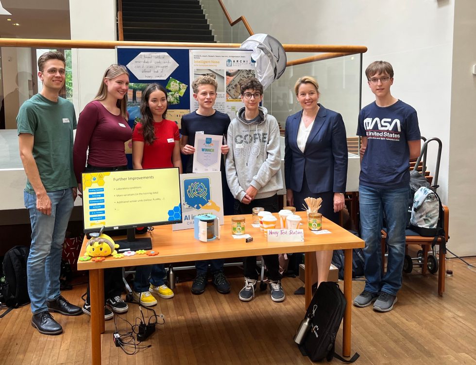 A student-teacher team at their stand for a science competition