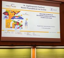 A screen with the conference logo of Poland's science festival