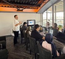 A group of teachers in a workshop room
