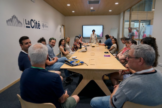 Group of people sitting around a table at a workshop