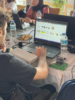 A workshop participant working on a computer