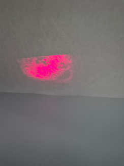 one red light pattern on a white wall