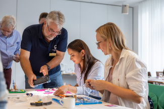 Three people in a workshop