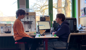 Two students in a classroom setting