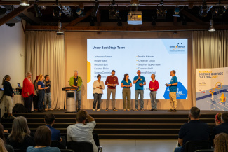 The members of the Science on Stage backstage team on stage