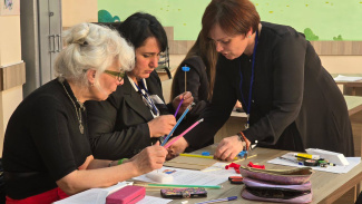 Three women during a science workshop