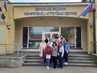A group of teachers in front of a Latvian education centre