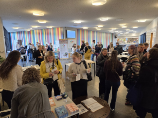 A conference hall with visitors during a science exhibition