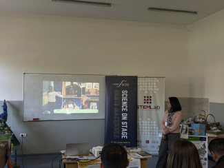 A presenter next to a screen in a conference room
