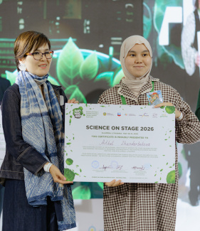 Two people holding an award certificate