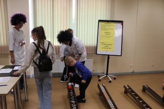 A group of young people in a workshop setting