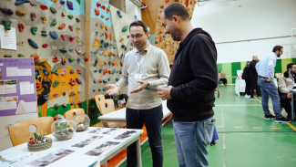 Two teachers at a stand during a science conference
