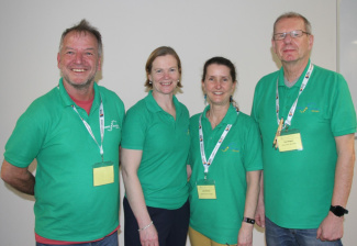 4 teachers in green t-shirts