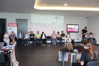 A row of teachers sitting in a seminar room for the opening of a science festival