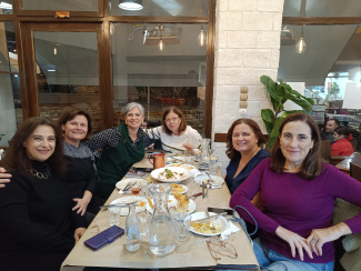 A group of women around a dinner table