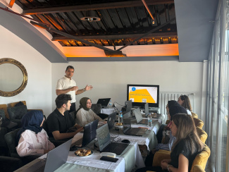 A group of teachers in a workshop room